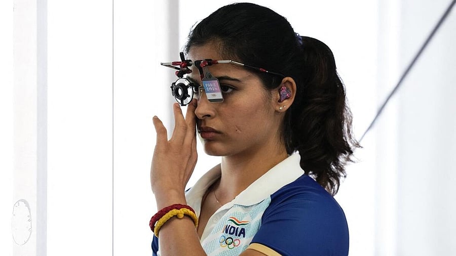 <div class="paragraphs"><p>Manu Bhaker adjusts her eyepiece during the qualification round. </p></div>
