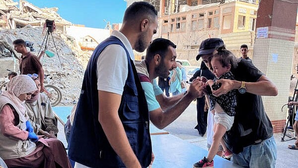 <div class="paragraphs"><p>A Palestinian child cries during a polio vaccination campaign, amid the Israel-Hamas conflict, in Deir Al-Balah in the central Gaza Strip. </p></div>
