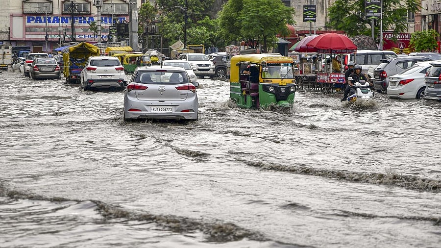 <div class="paragraphs"><p>Vehicles pass through a waterlogged street after heavy monsoon rains, in Jaipur. </p></div>