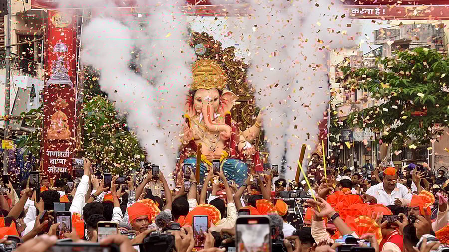 <div class="paragraphs"><p>Devotees carry an idol of Lord Ganesha to pandal during a procession on the eve of the Ganesh Chaturthi festival, in Nagpur. </p></div>