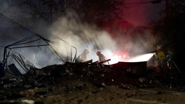 <div class="paragraphs"><p>Firefighters work to extinguish hot spots in burned structures as the Boyles Fire burns in Clearlake, California. </p></div>