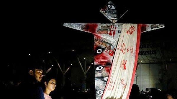 <div class="paragraphs"><p>People attend a protest condemning and marking one month since the rape and murder of a trainee medic at a government-run hospital in Kolkata, India, September 8, 2024.</p></div>