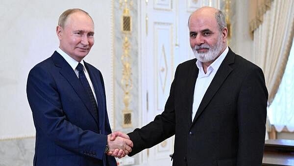 <div class="paragraphs"><p>Russia's President Vladimir Putin shakes hands with Iran's Supreme National Security Council Secretary Ali Akbar Ahmadian during a meeting in Saint Petersburg, Russia. </p></div>