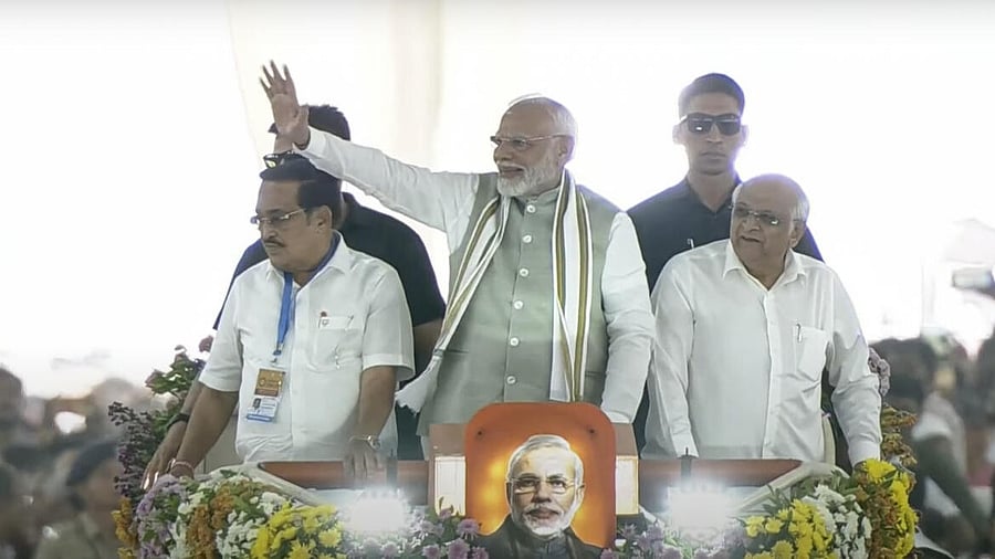 <div class="paragraphs"><p>PM Modi waves to crowd during a public meeting in Ahmedabad. </p></div>