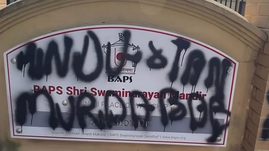 <div class="paragraphs"><p>A vandalised board of the temple. </p></div>