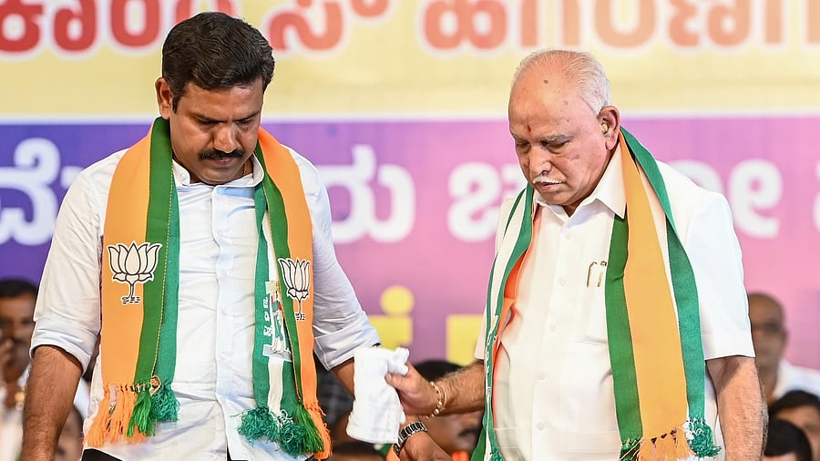 <div class="paragraphs"><p>BJP's B Y Vijayendra (left) is seen with his father and party veteran B S Yediyurappa. </p></div>