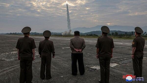 <div class="paragraphs"><p>North Korean leader Kim Jong-un looks on during the test of what KCNA described as a new tactical ballistic missile</p></div>