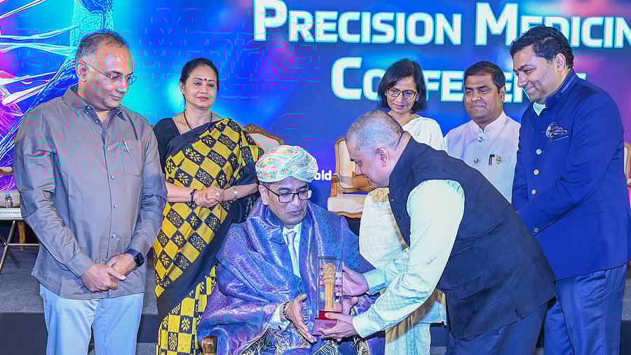 <div class="paragraphs"><p>Chief Justice of India D Y Chandrachud was honoured at a two-day conference on gene therapy in Bengaluru on Saturday. Karnataka health minister Dinesh Gundu Rao (left), looks on. </p></div>