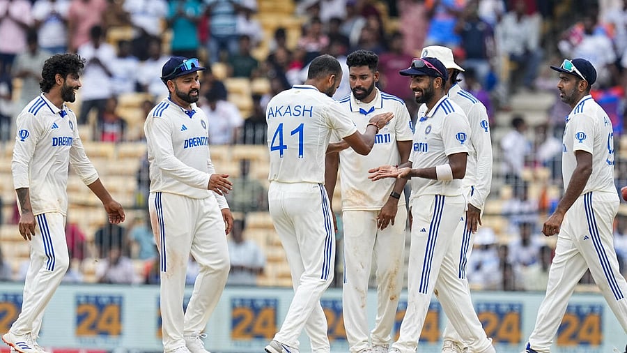 <div class="paragraphs"><p> Ravindra Jadeja with teammates celebrates the dismissal of Bangladesh's Najmul Hossain Shanto on the fourth day of the first Test cricket match between India and Bangladesh, at MA Chidambaram Stadium in Chennai.</p></div>