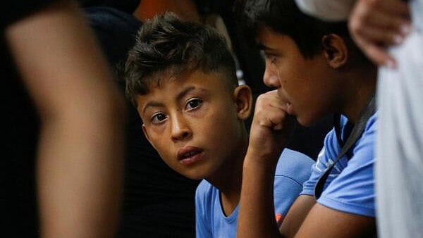<div class="paragraphs"><p>Internally displaced boys who fled with their family from southern Lebanon villages due to ongoing cross-border hostilities between Hezbollah and Israeli forces, react at a makeshift shelter in Dekwaneh, Lebanon. </p></div>