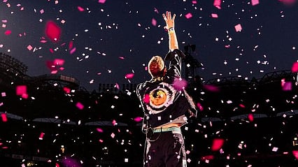 <div class="paragraphs"><p>Chris Martin at a concert.</p></div>
