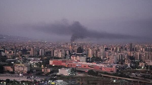 <div class="paragraphs"><p>Smoke billows over Beirut's southern suburbs after overnight strikes, amid ongoing hostilities between Hezbollah and Israeli forces, as seen from Sin El Fil, Lebanon.</p></div>