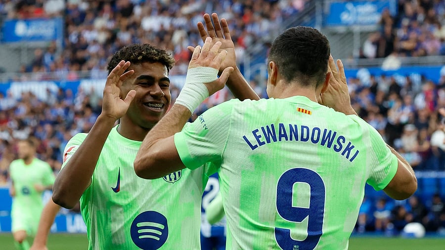 <div class="paragraphs"><p>FC Barcelona's Robert Lewandowski celebrates scoring their third goal with Lamine Yamal to complete his hat-trick.</p></div>