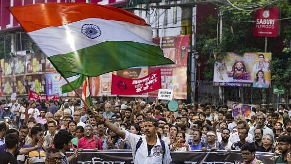<div class="paragraphs"><p>Doctors along with other civillian protestors participate in a mega rally to protest against the rape and murder case at RG Kar hospital, in Kolkata, Tuesday, Oct, 8, 2024.</p></div>