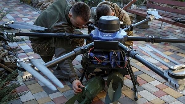 <div class="paragraphs"><p>Servicemen of the 15th Operative Purpose Brigade 'Kara-Dag' of the National Guard of Ukraine attach explosive devices to a Kazhan combat drone before flying over positions of Russian troops, amid Russia's attack on Ukraine, near the town of Pokrovsk in Donetsk region. </p></div>