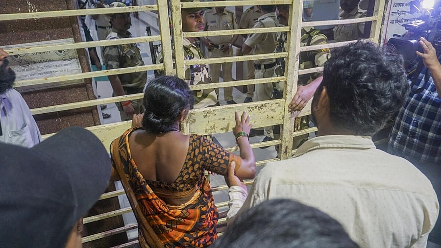 <div class="paragraphs"><p>Parents of Akshay Shinde, the accused in the Badlapur sexual assault case of two minor girls, outside the Kalwa Hospital where his body was brought after the police encounter, in Thane.</p></div>