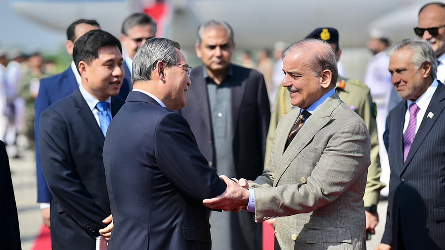 <div class="paragraphs"><p>PM Shehbaz Sharif greets Chinese Premier Li Qiang as he arrives in Rawalpindi on Oct 14, 2024 on a four-day bilateral visit.</p></div>