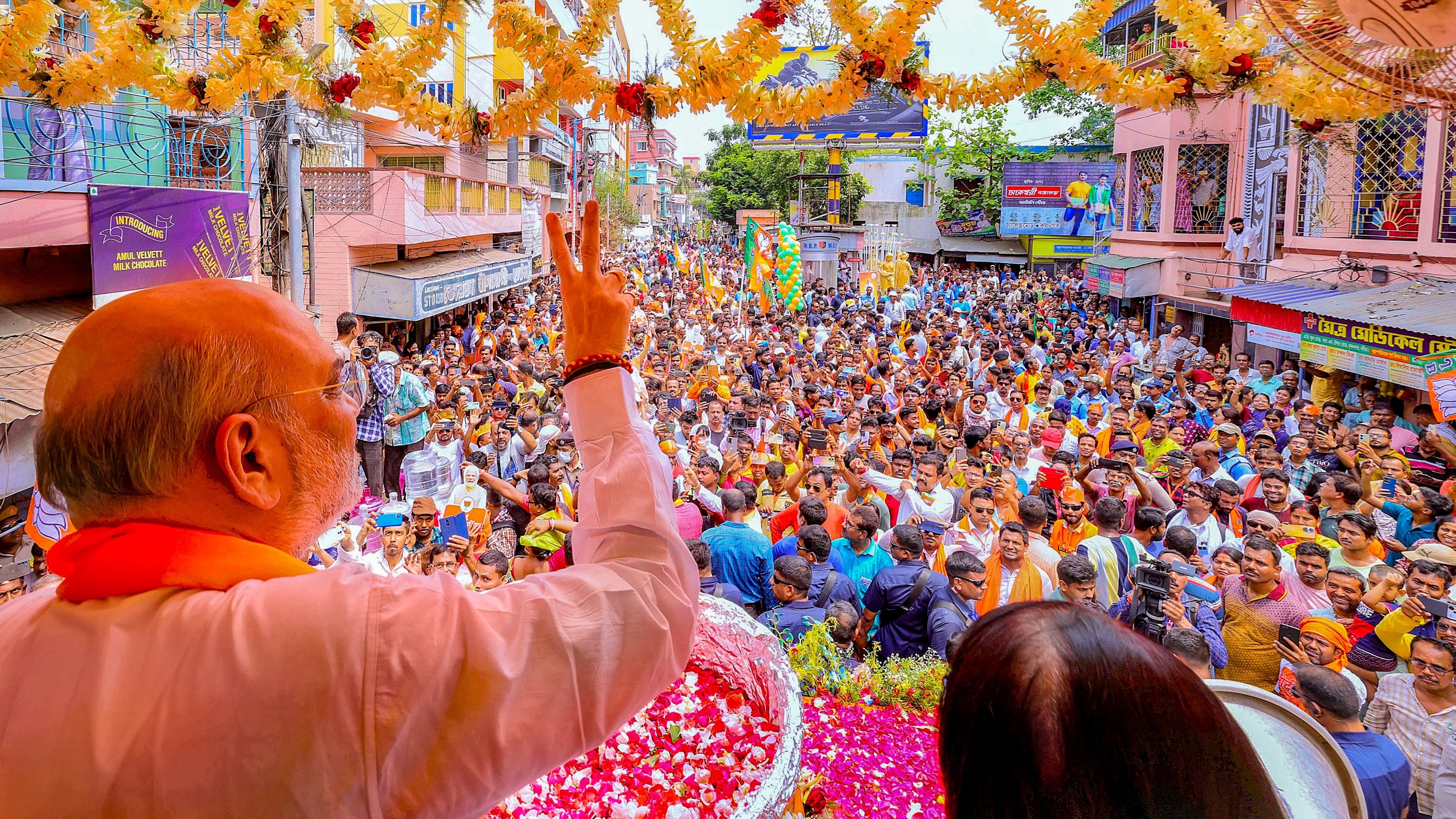 <div class="paragraphs"><p>Union Home Minister and BJP leader Amit Shah during a election road show. </p></div>
