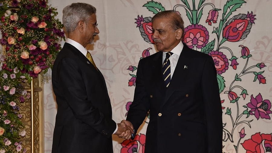 <div class="paragraphs"><p>EAM Dr S Jaishankar and Pakistan PM Shehbaz Sharif shake hands as the latter welcomes EAM and other SCO Council Heads of Government to a dinner hosted by him on Tuesday.&nbsp;</p></div>