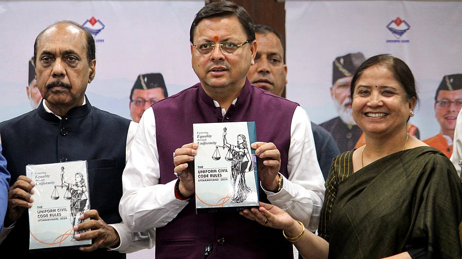 <div class="paragraphs"><p>Uttarakhand Chief Minister Pushkar Singh Dhami with the final draft of rules and regulations prepared by a committee constituted for the implementation of the Uniform Civil Code (UCC).</p></div>
