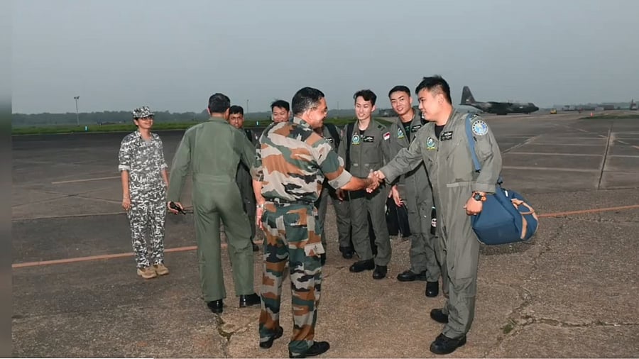 <div class="paragraphs"><p>IAF officers welcome members of the Republic of Singapore Air Force personnel at the Kalaikunda air base.</p></div>