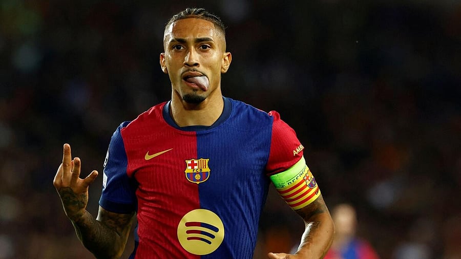 <div class="paragraphs"><p> FC Barcelona's Raphinha celebrates scoring their fourth goal to complete a hat-trick.</p></div>