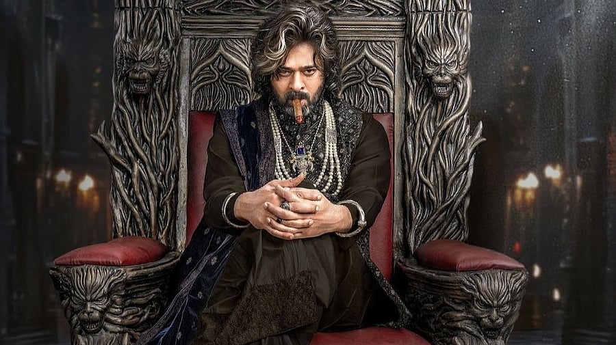 <div class="paragraphs"><p>Prabhas on the poster of <em>The Raja Saab.</em></p></div>