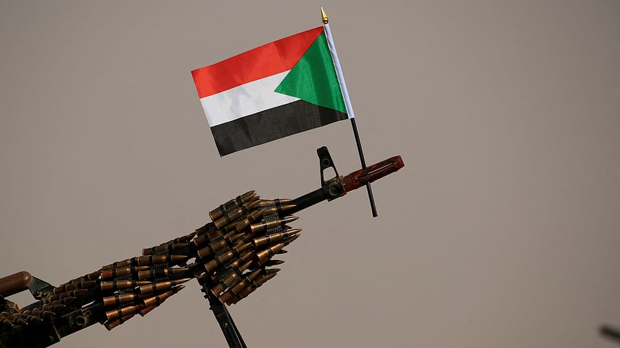 <div class="paragraphs"><p>A Sudanese national flag is attached to a machine gun of Paramilitary Rapid Support Forces  soldiers.</p></div>