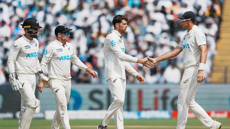 <div class="paragraphs"><p>New Zealand's Mitchell Santner celebrates with captain Tom Latham and others after taking the wicket of India’s Yashasvi Jaiswal.</p></div>