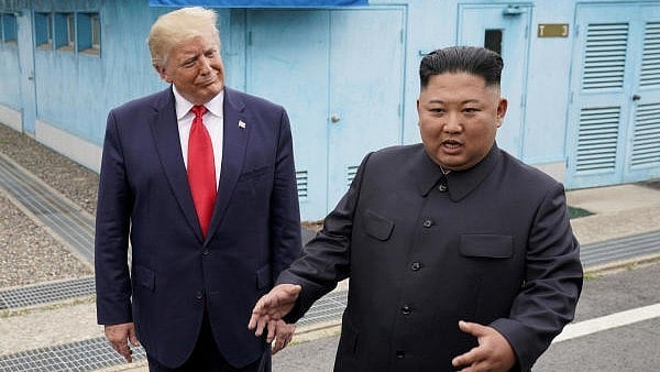 <div class="paragraphs"><p> US President Donald Trump with North Korean leader Kim Jong Un.</p></div>