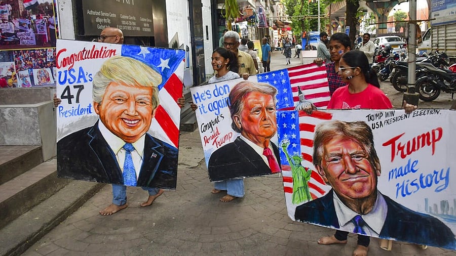 <div class="paragraphs"><p>Students of Gurukul School of Art show painted portraits of Donald Trump as they greet him on his victory in the US Presidential election, at Lalbaug in Mumbai, Wednesday, November 6, 2024.</p></div>