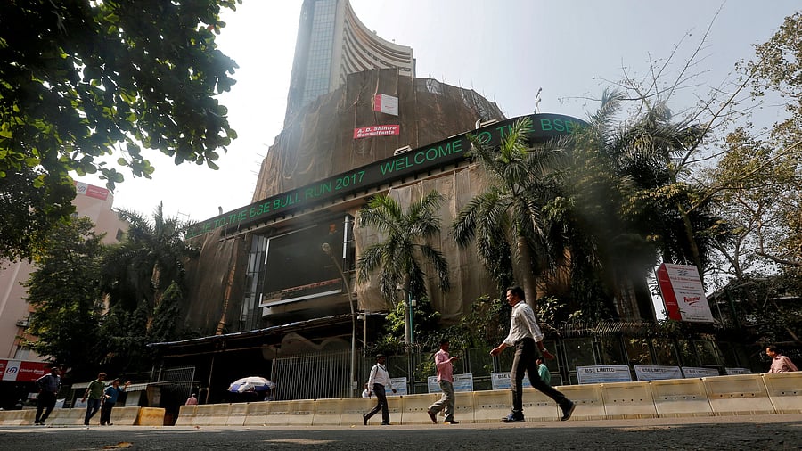 <div class="paragraphs"><p>File Photo: People walk past the Bombay Stock Exchange building in Mumbai, India.</p></div>