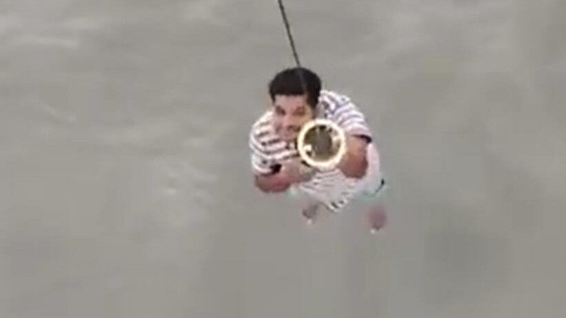 <div class="paragraphs"><p>A rescue operation being conducted by the Indian Coast Guard in a flooded area, in Daman.</p></div>