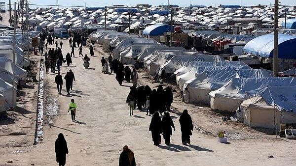 <div class="paragraphs"><p>Women walk through al-Hol displacement camp in Hasaka governorate, Syria. </p></div>
