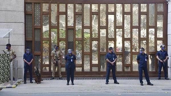 <div class="paragraphs"><p>File photo of police personnel guard outside industrialist Mukesh Ambani's residence Antilla. </p></div>