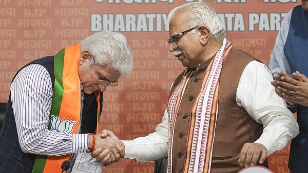 <div class="paragraphs"><p>Union Minister and senior BJP leader Manohar Lal greets former AAP leader Kailash Gahlot as he joins the BJP, in New Delhi on Monday.</p></div>