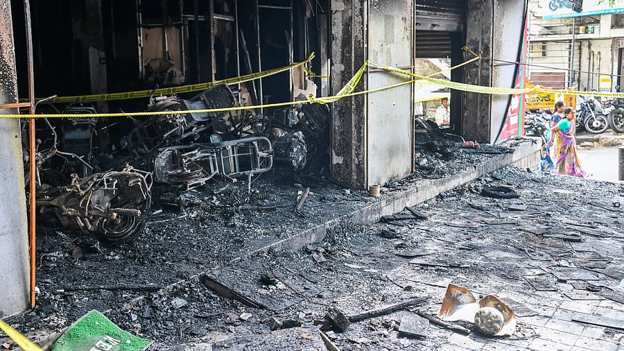 <div class="paragraphs"><p>The EV scooter showroom that was gutted on Tuesday, on Rajkumar Road in Rajajinagar. </p></div>