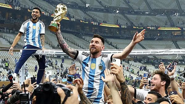 <div class="paragraphs"><p>Argentina's Lionel Messi celebrates with the trophy after winning the World Cup.</p><p></p></div>