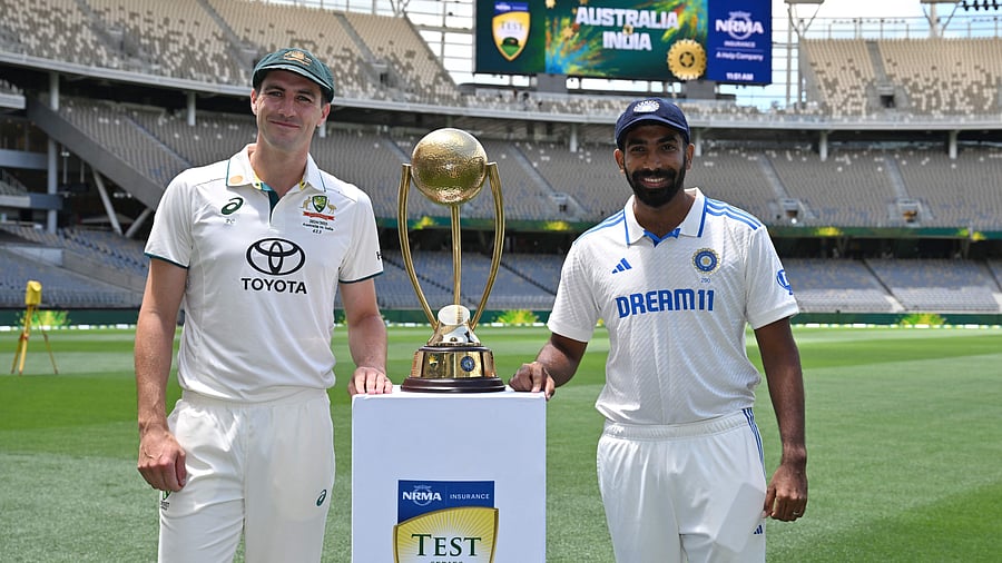 <div class="paragraphs"><p>India captain Jasprit Bumrah (right) and his Australian counterpart Pat Cummins pose with Border-Gavaskar Trophy on the eve of the first Test at the Optus Stadium in Perth. </p></div>