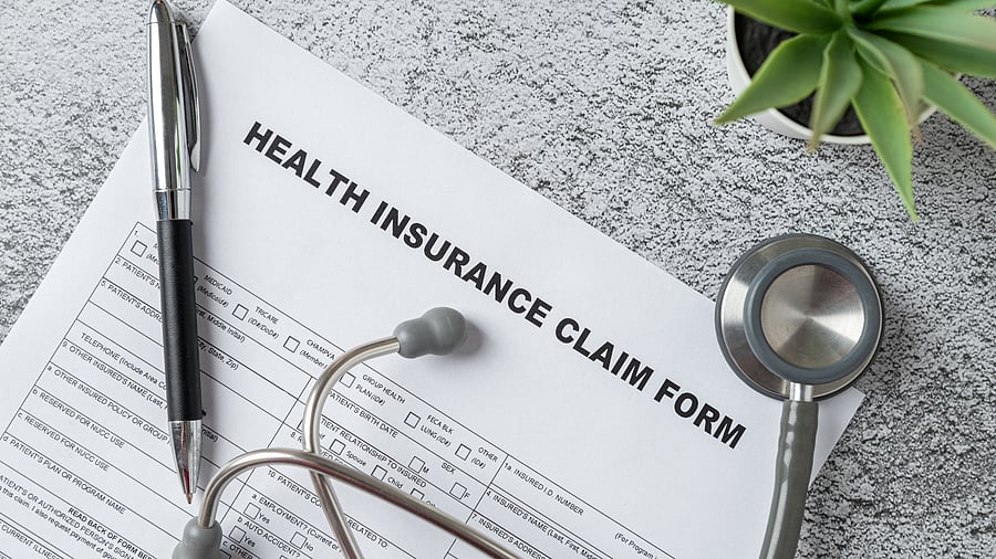 <div class="paragraphs"><p>Top view of doctor's stethoscope, pen and health insurance claim form on table </p></div>