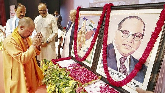 <div class="paragraphs"><p>Uttar Pradesh Chief Minister Yogi Adityanath pays tribute to a portrait of Dr. B R Ambedkar on 'Samvidhan Diwas', in Lucknow.</p></div>