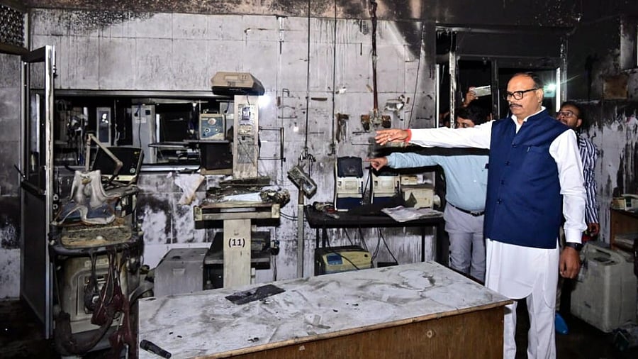 <div class="paragraphs"><p>Uttar Pradesh Deputy Chief Minister Brajesh Pathak with other officials during an inspection after a fire broke out inside the Neonatal Intensive Care Unit (NICU) of the Maharani Laxmi Bai Medical College, in Jhansi district.</p></div>