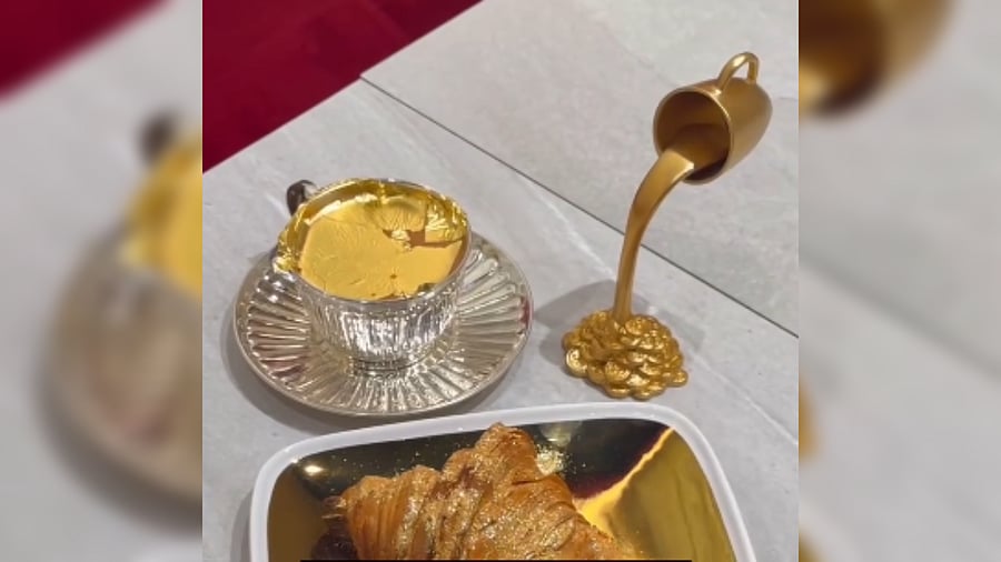 <div class="paragraphs"><p>The 'Gold Karak Tea' along with Gold-dusted croissant.</p></div>