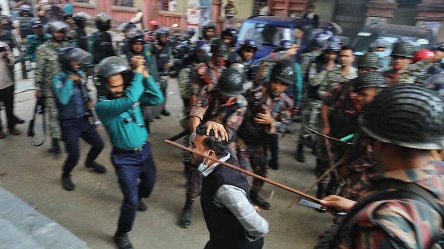 <div class="paragraphs"><p>Law enforcers charge batons to disperse followers gathered to demand the release of their leader Chinmoy Krishna Das, a Hindu leader associated with the International Society for Krishna Consciousness (ISKCON), who appeared at the Chattogram Metropolitan Magistrate Court, in Chattogram, Bangladesh.</p></div>