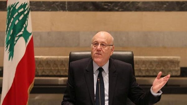 <div class="paragraphs"><p>Lebanon's caretaker Prime Minister Najib Mikati gestures as he heads a cabinet meeting at the government palace after a ceasefire between Israel and Hezbollah took effect, in Beirut, Lebanon on November 27.</p></div>