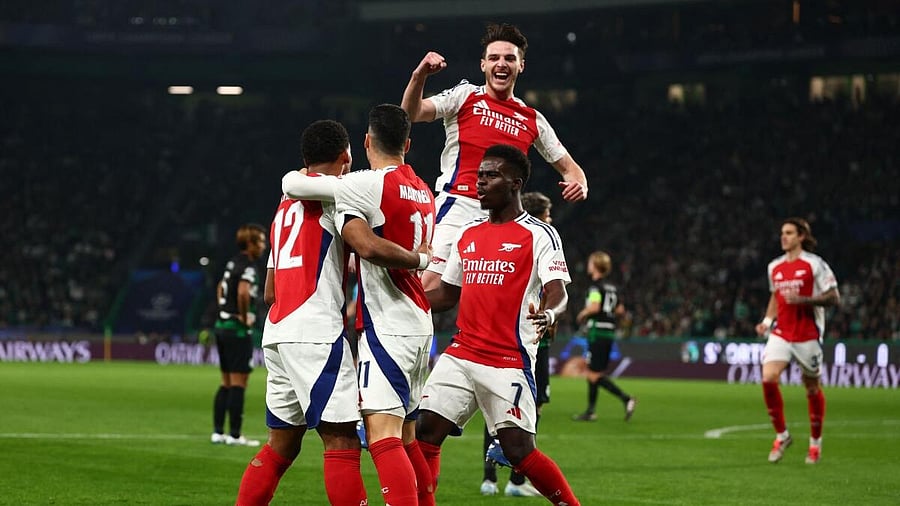 <div class="paragraphs"><p>Arsenal's Gabriel Martinelli celebrates scoring their first goal with Jurrien Timber, Bukayo Saka and Declan Rice</p></div>
