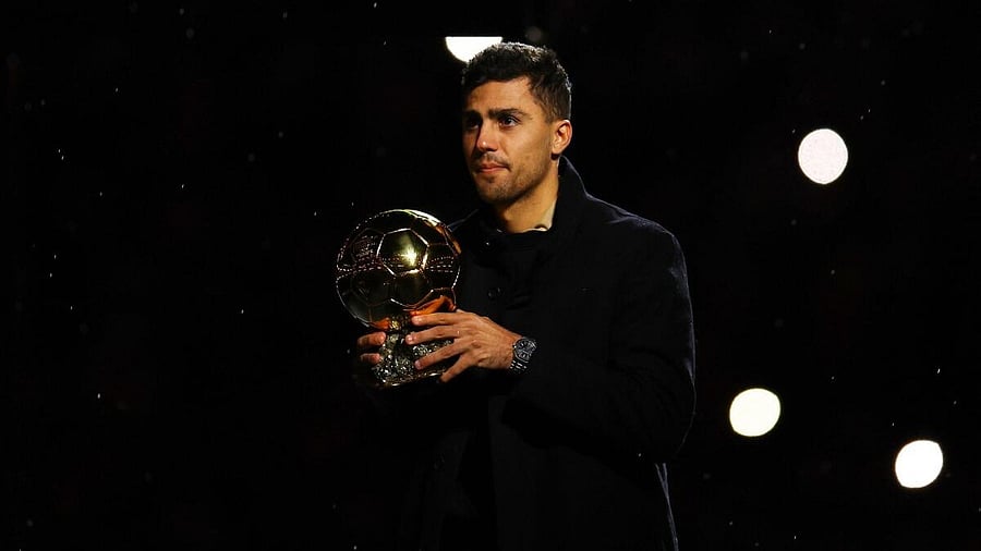 <div class="paragraphs"><p>Manchester City's Rodri with the Ballon d'Or trophy.</p></div>