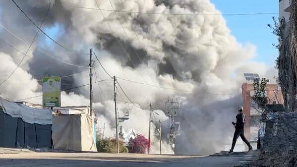 <div class="paragraphs"><p>Smoke billows from a residential building hit by an Israeli strike, amid the ongoing conflict between Israel and Hamas, in Nuseirat refugee camp, in the central Gaza Strip, November 28, 2024, in this screengrab taken from a video. </p></div>