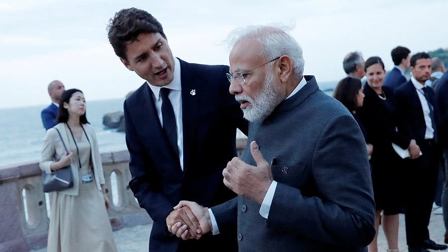 <div class="paragraphs"><p>File Photo: Canada's Prime Minister Justin Trudeau shakes hands with Prime Minister Narendra Modi.</p></div>