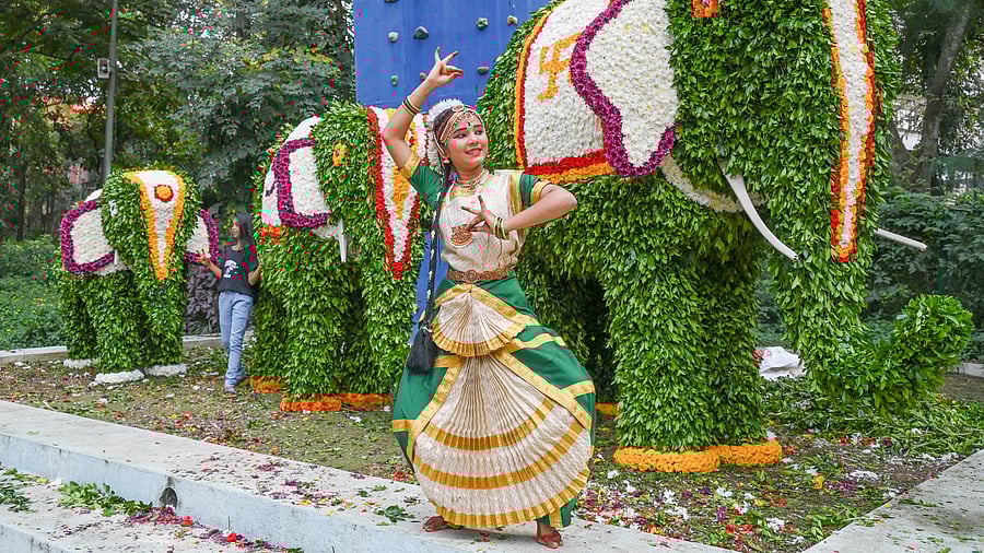 <div class="paragraphs"><p>A dancer in front of a floral sculpture of an elephant at Jawahar Bal Bhavan, Cubbon Park, on Thursday. The show will be on from&nbsp;November 29-December 2. </p></div>